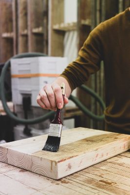 Image of varnish application on wood but Can You Varnish Over Paint?