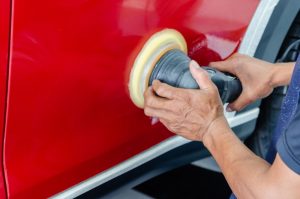 Image of a painter sanding a car but What Is Blending In Auto Painting?